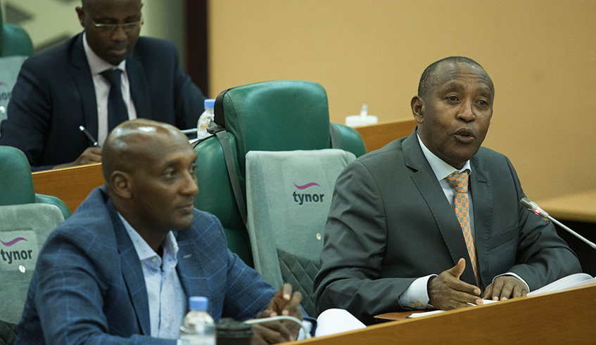 Ephraim Turahirwa, Chairperson, Rwanda Social Security Board (right) and RSSB Director-General Richard Tusabe appear before the Senate at Parliament Buildings in Kigali, yesterday. Senators questioned the Boardu2019s investment which they said did not result in value for money, but RSSB officials pledged to turn things around. 