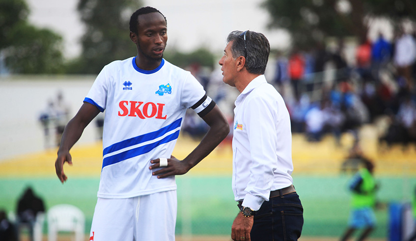 Rayon Sports head coach Roberto Oliveira chats with skipper Thierry Manzi during a past league match against Police at Kigali Stadium. Sam Ngendahimana.