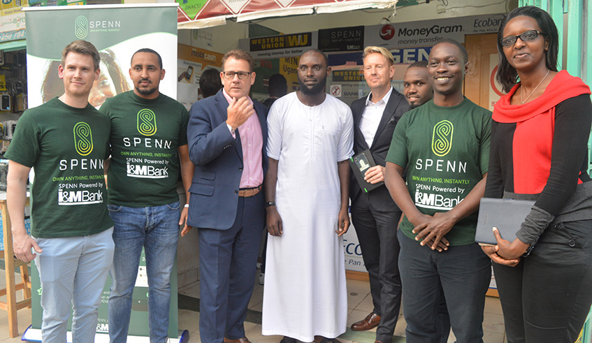 Spenn staff together with the managing director I&M Bank Robin Bairstow, Blockbondsu2019 CEO, Mr.Jens Glaso take a picture with the agent. Joseph mudingu
