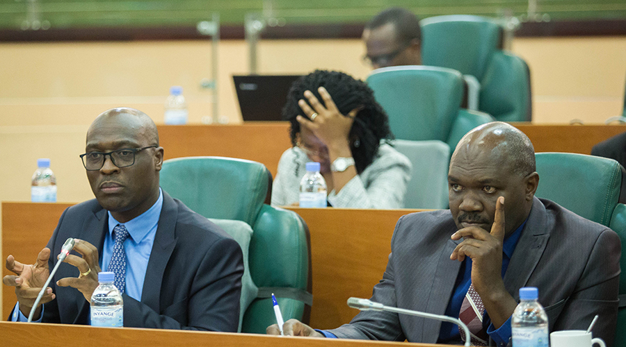 Aimu00e9 Muzola, CEO of WASAC, addresses the Senate about the Auditor Generalu2019s report as Dr. Omar Munyaneza, WASAC Board Chairperson, listens. / Nadu00e8ge Imbabazi