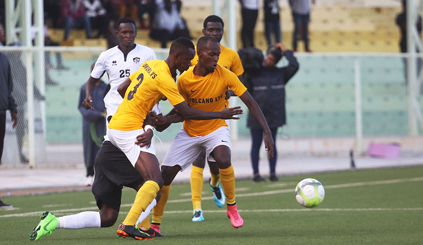 Mukura players snatch the ball from APR defenders during a past league match at Kigali Stadium, which ended 1-0 in favor of Mukura. Sam Ngendahimana.