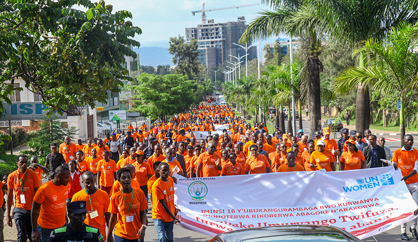 Officials march at the launch of the 16Days of Activism on Ending Violence Against Women and Girls