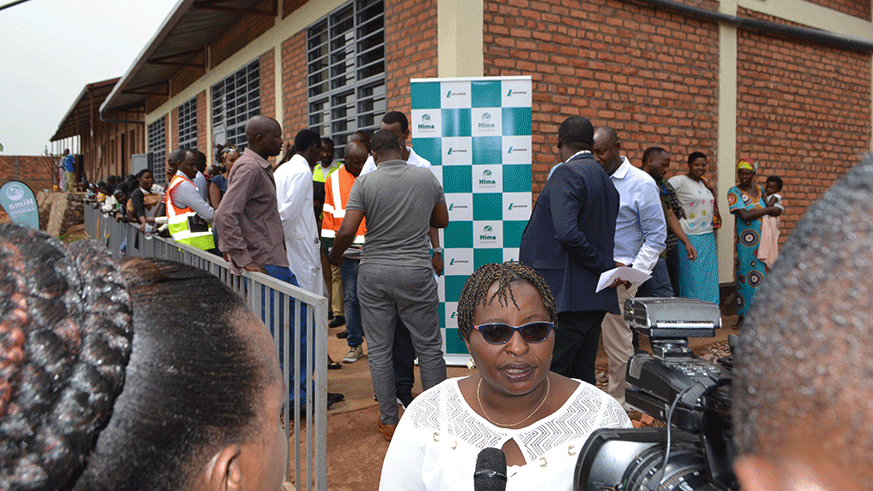 Languide Nyirabahire, Vice Mayor in charge of Social Affairs at Gasabo District speaks to media after handover of a two-classroom block at Nyacyonga Primary School. Courtesy.