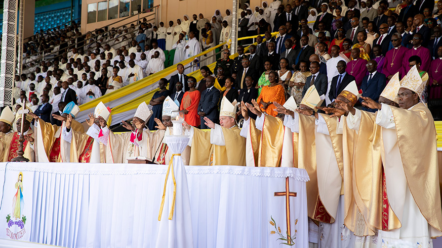 Bishops present bless the congregation.