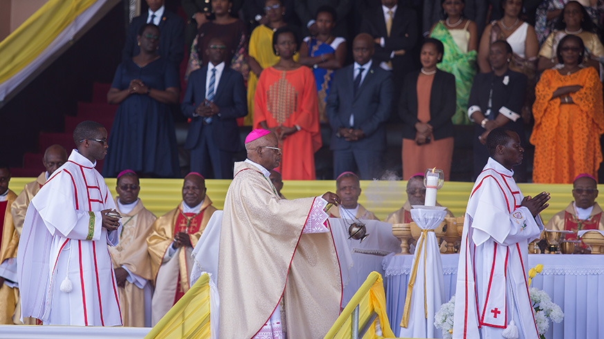  Outgoing Archbishop Ntihinyurwa uses the incense to the congregation during the well-attended service.