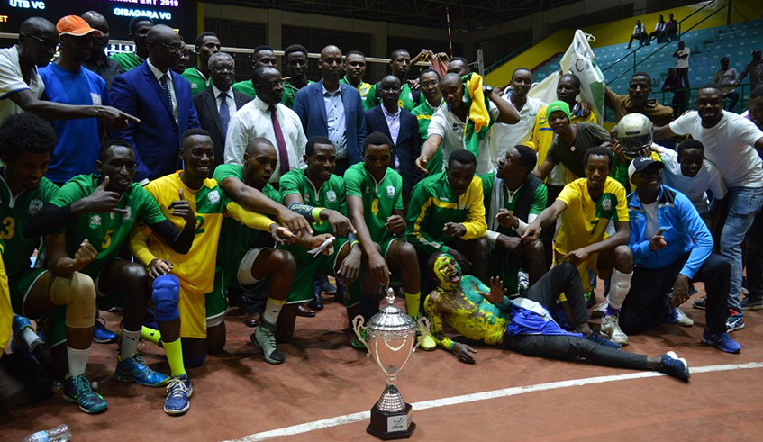 UTB players and staff celebrate with the trophy after beating Gisagara to win this year's Heroes Cup at Amahoro Stadium on Sunday. Damas Sikubwabo