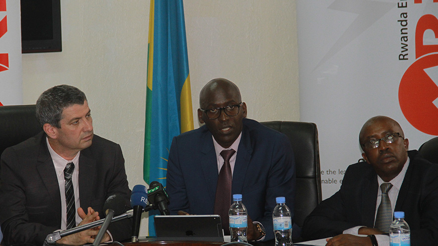Ron Weiss, CEO of REG, Maj. Eng Jean Claude Kalisa, Managing Director of EUCL addresses the media  and Wilson Karegeya, the Director for Commercial Services at the Energy Utility Corporation Ltd (EUCL). / Frederic Byumvuhore