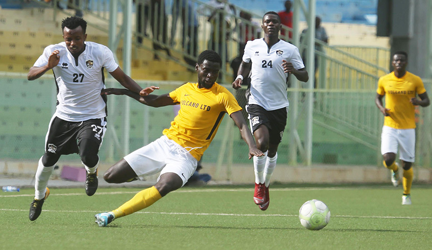 Striker Bertrand Iradukunda challenges APR forward Savio Dominique Nshuti (L) and defender Emmanuel Manishimwe (R) for the ball during Mukurau2019s 1-0 victory over the defending champions this month. Sam Ngendahimana
