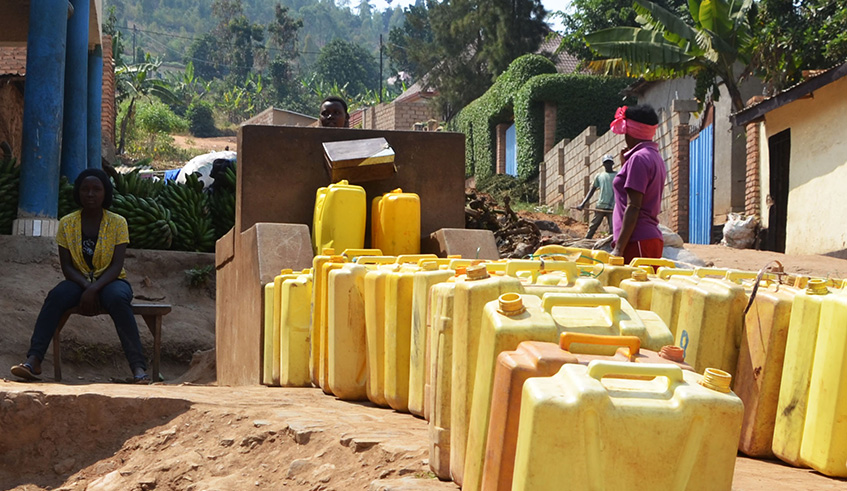 People fetch water at a public tap in Gasabo District. Rwanda Utility Regulatory Authority (RURA) has released new water tariffs. File.