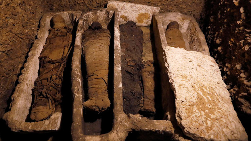Mummies are seen inside a tomb during the presentation of a new discovery at Tuna el-Gebel archaeological site in Minya Governorate, on Saturday. Net photo.