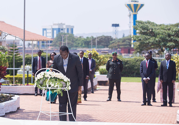 Senate president, Bernard Makuza pays respect to heroesâ€™ grave with other officials (in the Background)  yesterday at the National Heroesâ€™ Mausoleum during the celebration of heroes day. Nadege Imbabazi