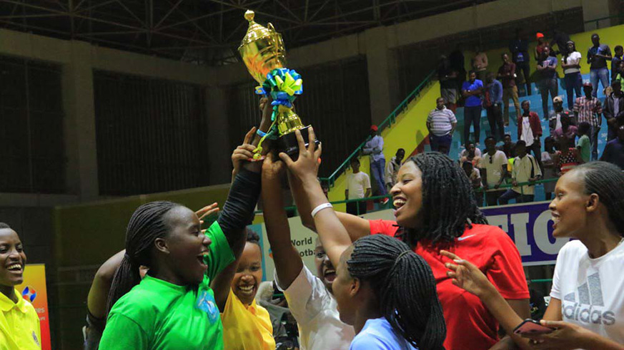 The Hoops Rwanda players lift the trophy up high to celebrate their stunning campaign in Heroes Cup tournament despite losing to Ubumwe in the last game Amahoro Stadium on Friday. Courtesy.