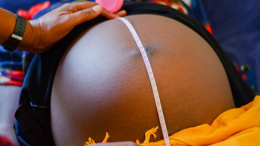 A baby bump during checkup. Net photo.