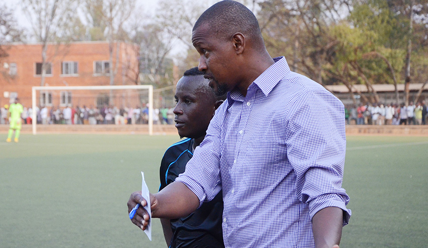 Andre Casa Mbungo, seen here giving instructions to Robert Ndatimanma during his time at Police FC in 2015, remains the only coach to win Peace Cup titles with two different teams. Sam Ngendahimana.