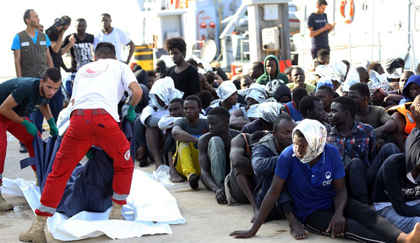 Rescued immigrants are seen at a naval base in Tripoli in June last year. Net photo.