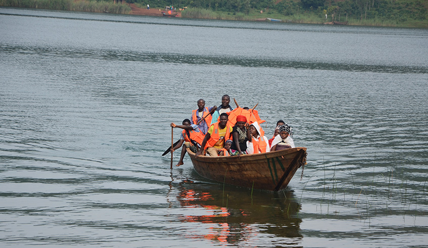 A group of Nkombo Islanders on a boat in Lake Kivu. Sam Ngendahimana.