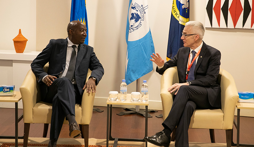 Interpol Secretary General Ju00fcrgen Stock chats with Prime Minister Edouard Ngirente during the ongoing 24th Interpol African Regional Conference at Kigali Convention Centre yesterday. Delegates at the conference have been urged to strengthen cooperation in the fight against crimes. Courtesy.