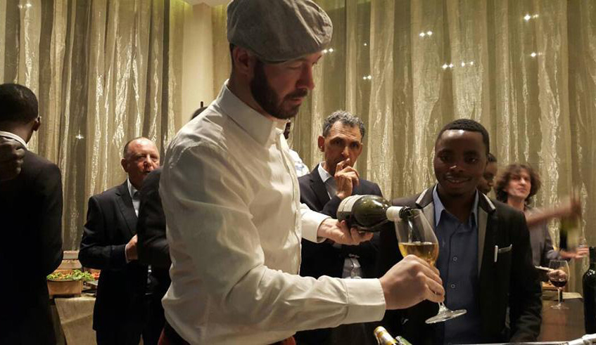 A professional wine taster serves a guest at the past wine tasting event at Kigali Marriott, last year. File. 