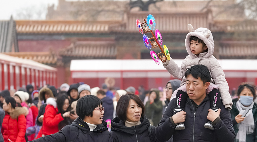 Tourists visit a fair exhibiting Chinese time-honored brands at the Palace Museum in Beijing, capital of China, Feb. 5, 2019, the first day of Chinese Lunar New Year. / Xinhua/Shen Bohan