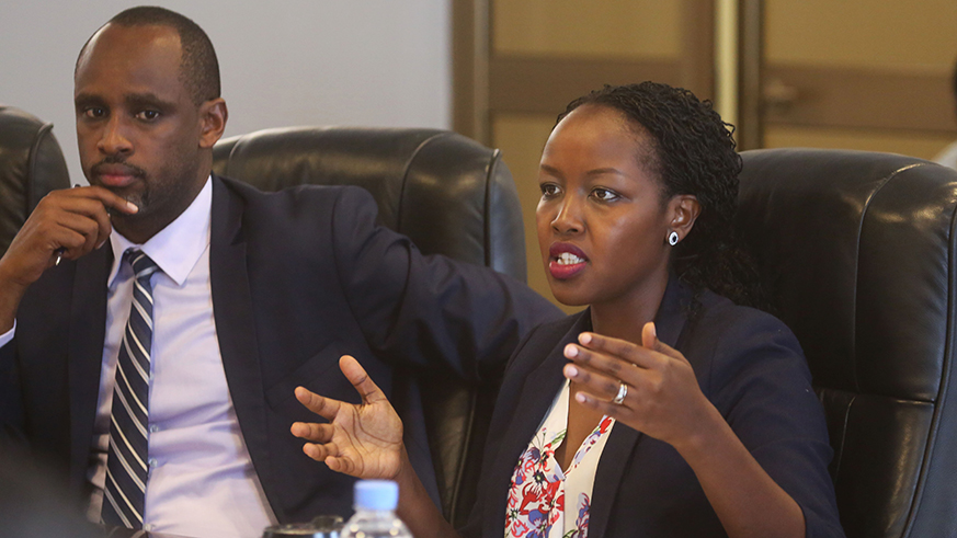 Minister of ICT Paula Ingabire addresses MPs as Innocent Muhizi, the chief executive of Rwanda Information Society Authority, looks on in Kigali yesterday. Sam Ngendahimana.