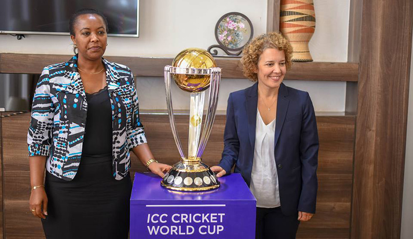Sports Minister Espu00e9rance Nyirasafari and UK High Commissioner to Rwanda Jo Lamos with the Cricket World Cup trophy yesterday.