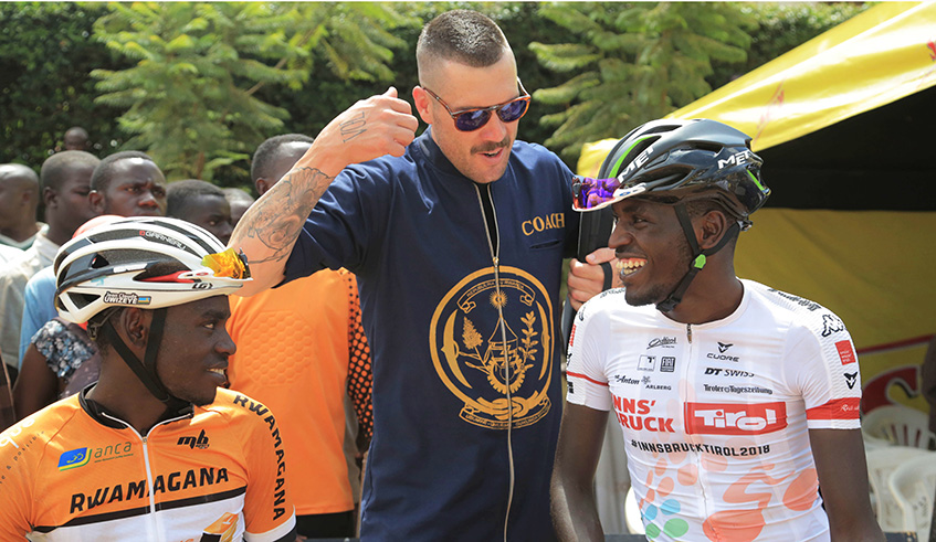 Team Rwanda head coach Sterling Magnell chats with Jean Claude Uwizeye and Valens Ndayisenga (Sam Ngendahimana)