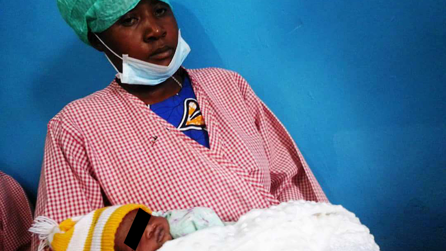 Uwamahoro holds her baby at Kabgayi District Hospital. Marie Anne Dushimimana.
