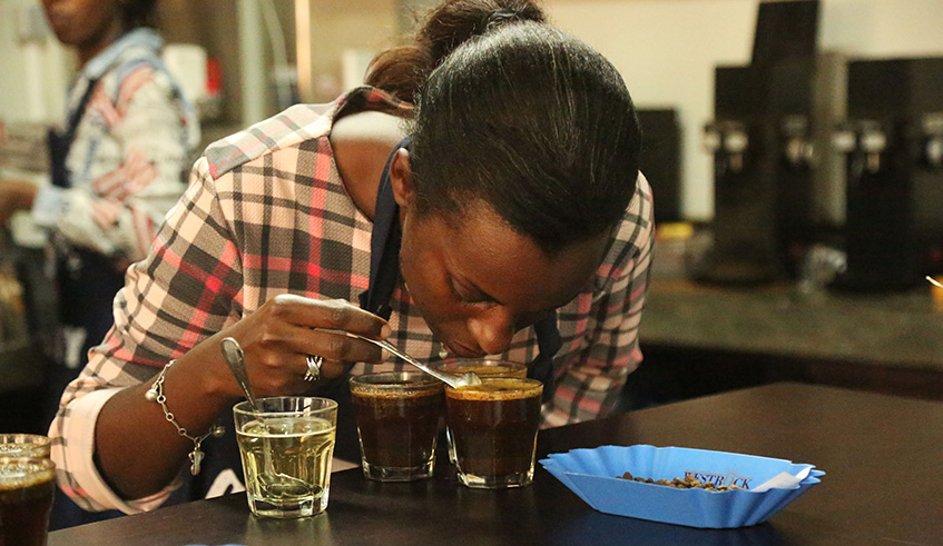 A specialist tastes Rwandan coffee at Rwanda Trading Company in Kigali. Sam Ngendahimana.