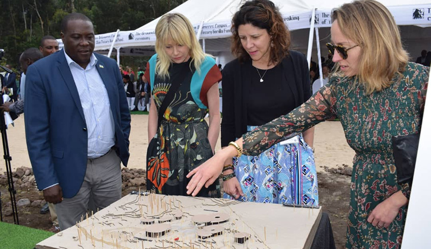 Northern Province Governor Jean Marie Vianney Gatabazi (left), Portia de Rossi, the director of Ellen Fund (2nd left) and other conservationists observe the artistic impression of the launched campus. Ru00e9gis Umurengezi.