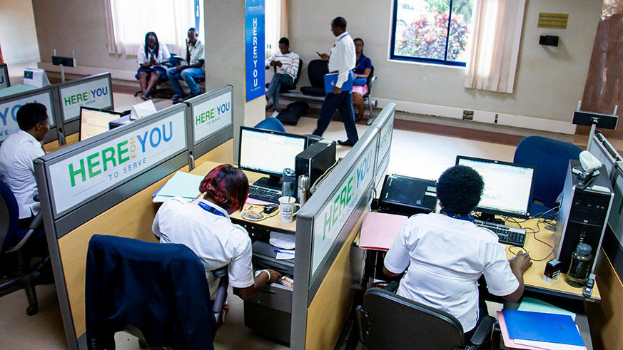 Staff members of Rwanda Revenue Authority at work at their headquarters in Kimihurura on Tuesday. The body collected Rwf 666 billion from tax and non-tax revenues in the period of July-Dec 2018. Emmanuel Kwizera.
