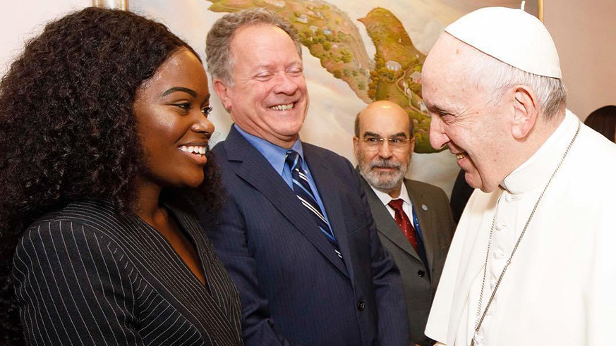 Pope Francis shakes hands with Rwandan choreographer and actress Sherrie Silver at a ceremony,  as she accepted her position as UNu2019s IFAD Global Advocate for Rural Youth on Feb. 14. Courtesy.