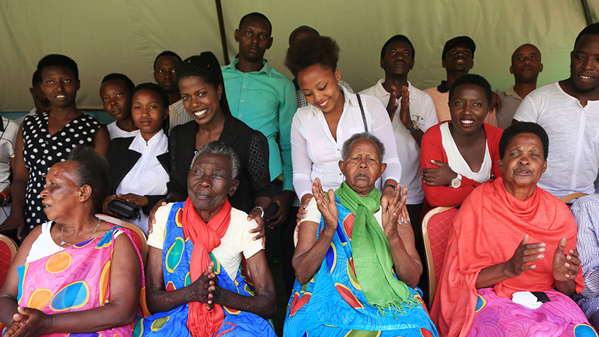 Some of the elderly genocide survivors whose families were completely wiped out in the Genocide against the Tutsi with youth in Nyanza District yesterday.  Sam Ngendahimana.