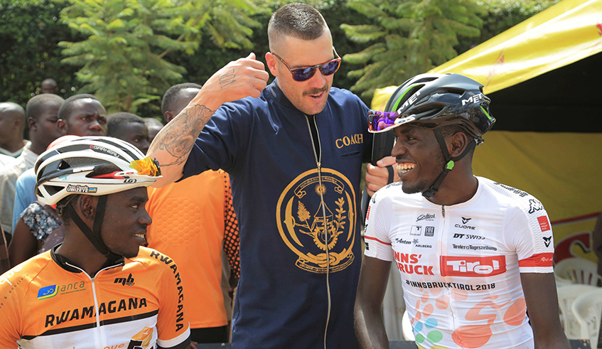 Team Rwanda head coach Sterling Magnell chats with two-time Tour du Rwanda champion  Valens Ndayisenga and  Jean Claude Uwizeye. Both will ride for Team Rwanda during Tour du Rwanda 2019  (Sam Ngendahimana)