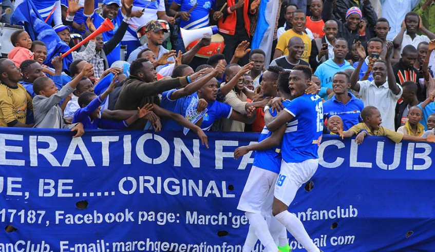 Ghana-born striker Micheal Sarpond (#19) celebrates his goal with teammates and fans at Huye Stadium after doubling Rayon Sports' lead against Mukura on Friday. Saddam Mihigo.