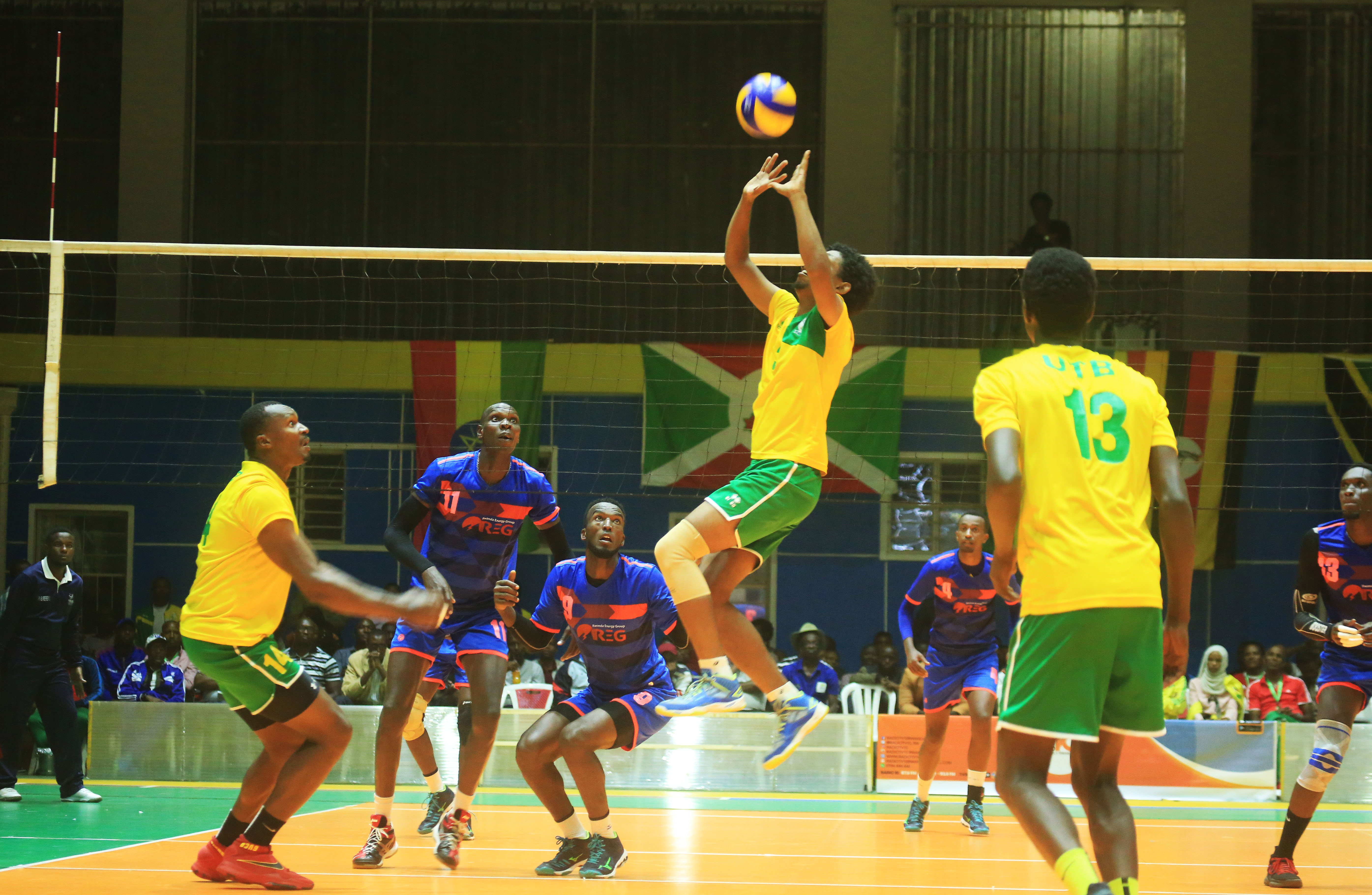 UTB volleyball club setter Ivan Mahoro Nsabimana sets the ball for Placide Sibomana (L) during their semi-final clash against REG, which they lost in four sets (25-21, 22-25, 29-31 and 23-25) at Amahoro Stadium on Friday night. Sam Ngendahimana