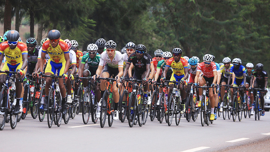 Tens of cyclists are seen here in a mass peloton shortly after being flagged off during Stage 1 of the 2018 Tour du Rwanda in Rwamagana District. Sam Ngendahimana