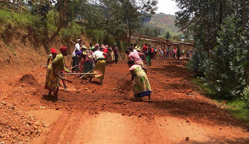 Residents of Nyaruguru District renovate a feeder road during a past Umuganda exercise. File.