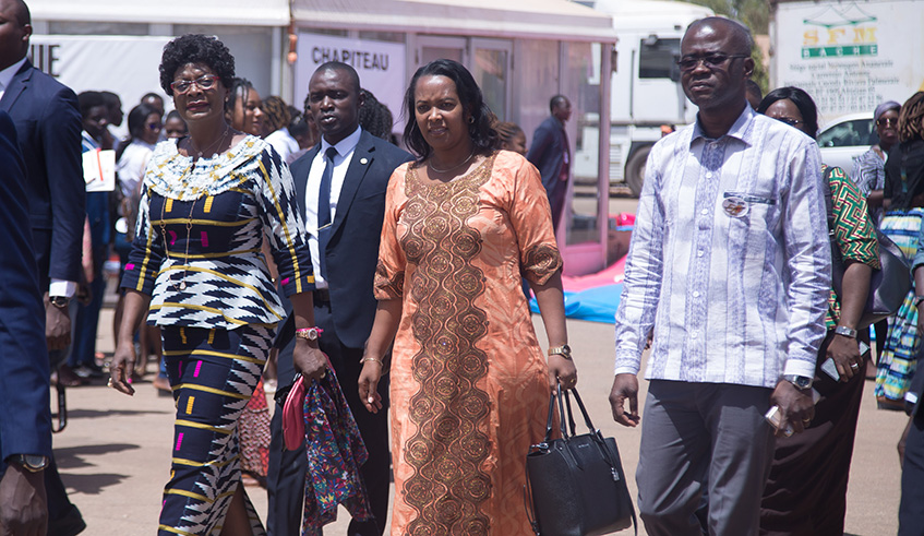 The first lady of Burkina Faso Mrs Sika Kabore and Esperance Nyirasafari, the Minister of Sports and Culture as they walk towards Rwanda Exhibition stand in FESPACO in Ouagadougou, Burkina Faso. All Photos by Nadege Imbabazi