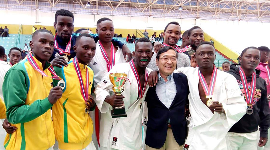 Ambassador Miyashita celebrates the victory with the Nyamagabe Karate Club members showing proudly their gold medals.