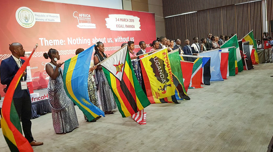 Some of the youth delegates drawn from 21 countries, with their respective countriesu2019 flags, at Kigali Convention Centre for a pre-conference youth event ahead of the Africa Health International Conference, yesterday. The conference proper is slated to open tomorrow in Kigali. Officials said there are plans to scale up the number of youth centres (multipurpose facilities) nationwide, up from 28 currently. / Courtesy.