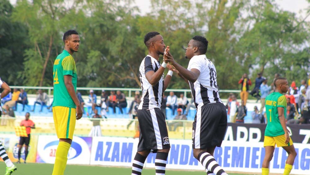 Muhadjiri Hakizimana (R) celebrates with teammate Issa Bigirimana after scoring his second goal. Saddam Mihigo