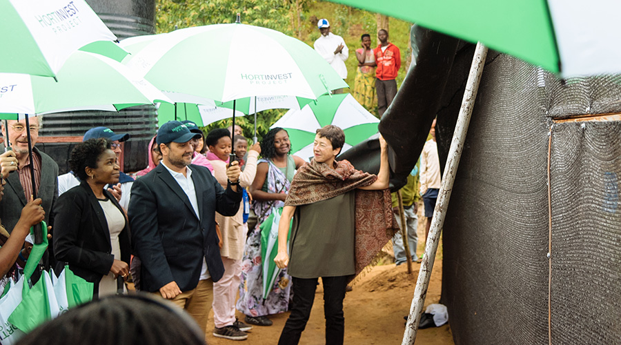 The Dutch Ambassador to Rwanda Fru00e9du00e9rique de Man unveiling a shade net constructed by HortInvest as part of agriculture demonstration site to farmers. / Courtesy photos