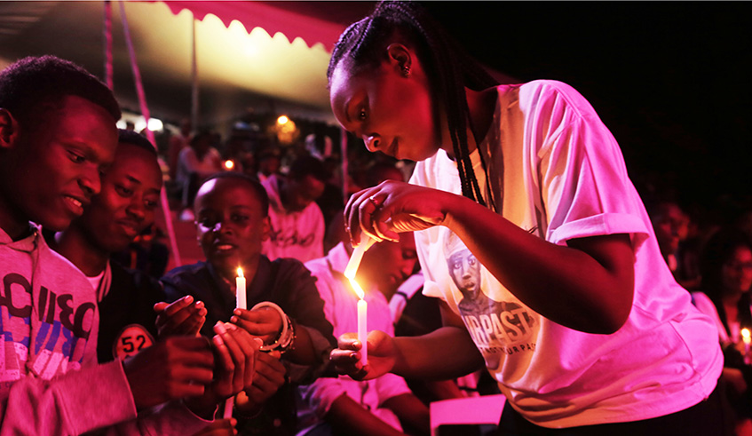 Youth lighten candles during the commemoration night   at Kigali Genocide Memorial ./Sam Ngendahimana
