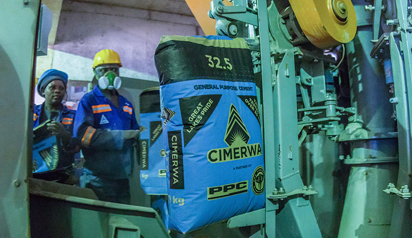 Workers fill bags with cement at Cimerwa. The company has been accused of instigating protectionism. Courtesy.