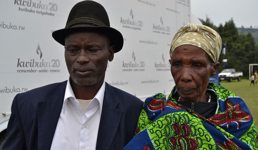 Ndibabaje poses with Ester Kazuba,one of Genocide survivors he rescued. The photo was taken few years ago during commemorations  of Genocide against Tutsi in Kinigi. Photos by Ru00e9gis Umurengezi.
