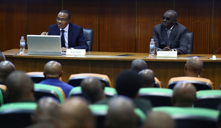 The Minister for Defence, Albert Murasira, speaks during the 31st Zigama CSS general meeting as Dr James Ndahiro, Chairman of Board, looks on at Kimihurura yesterday. Courtesy.