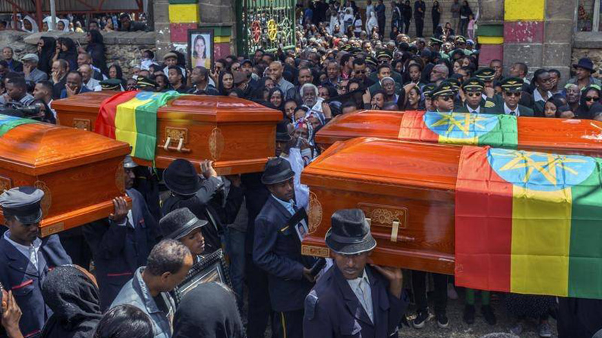 Relatives have wept over empty caskets at a mass funeral for the Ethiopian Airlines crash victims. Net photo.
