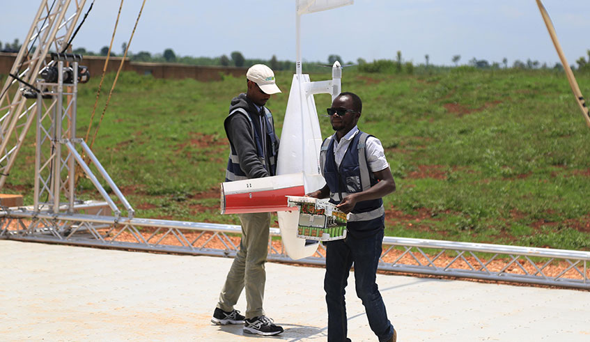 Workers remove parts of a drone at Ziplineu2019s Kayonza distribution centre. The company operates drone facilities in Muhanga and Kayonza for urgent delivery of blood and medicines, especially in remote Rwanda. Sam Ngendahimana.