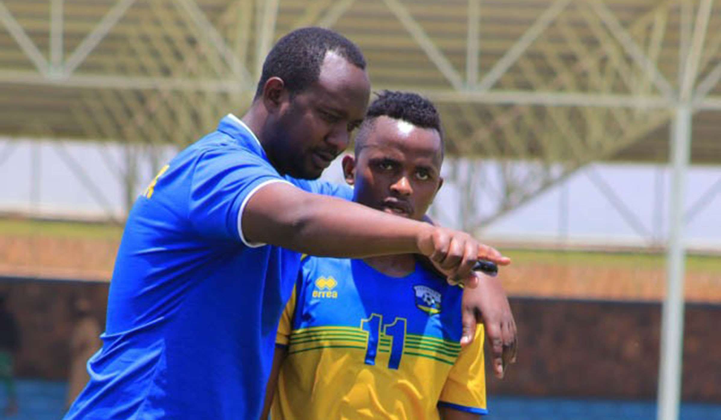 Young midfielder Kevin Muhire, seen here taking instructions from head coach Vincent Mashami during Wednesdayu2019s final training session at Kigali Stadium, is part of the 23-man final squad. Saddam Mihigo.