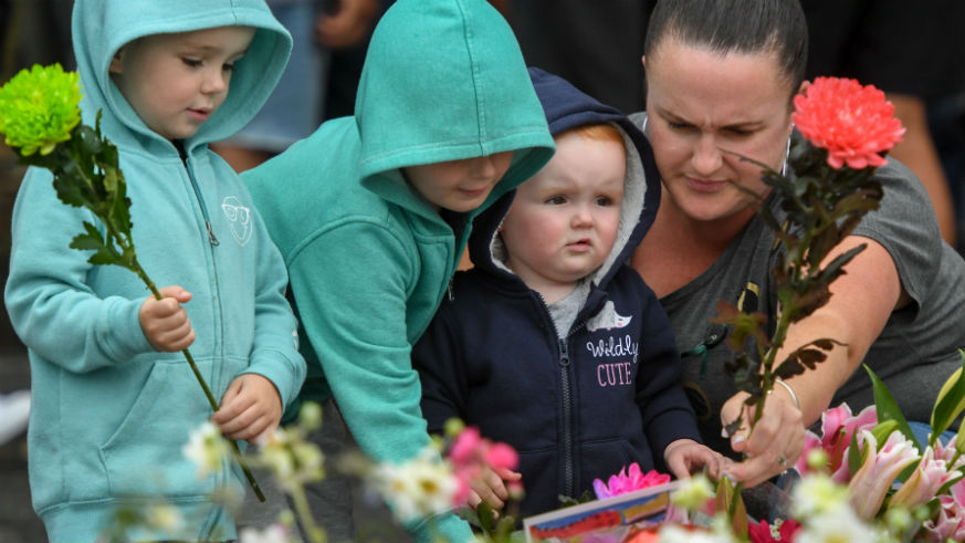 People place flowers to mourn the victims of the attacks on two mosques in Christchurch, New Zealand, on March 17, 2019. The death toll from the terror attacks on two mosques in New Zealand's Christchurch has risen to 50 as one more victim was found at one of the shooting scenes, the police said on Sunday. (Xinhua/Guo Lei)